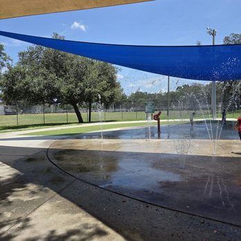 Covered splash pad with water fountains at All Person's Rotary Park