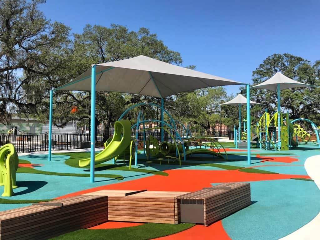 Colorful shaded play structures at Freedom Playground in Macfarlane Park